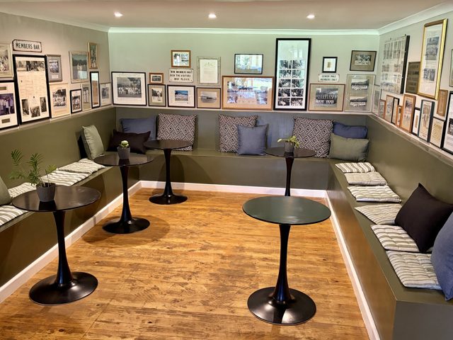 Seating beneath the club’s framed cricket archive