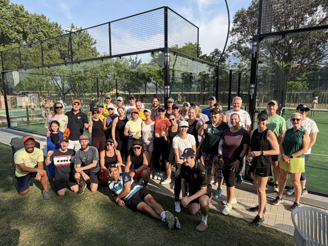 Players gathered beside the padel courts