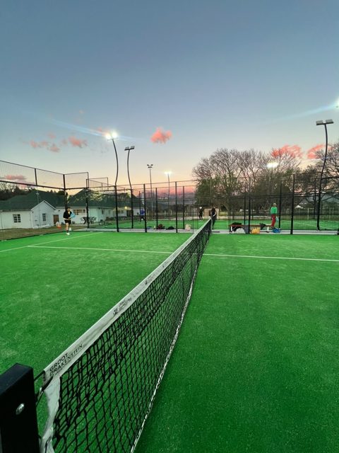 A padel court at sunset